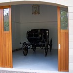 side sectional with windows in arched opening garage